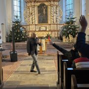 Preaching in a church during a visit.